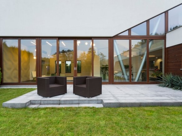 Villa patio with rattan chairs Your Gateway to Properties in Laos