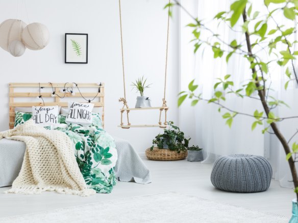 Bedroom with gray pouf Your Gateway to Properties in Laos